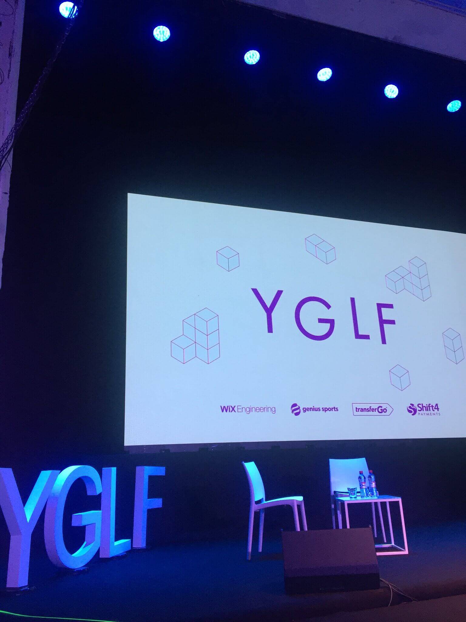 The YGLF placeholder slide used throughout the day.